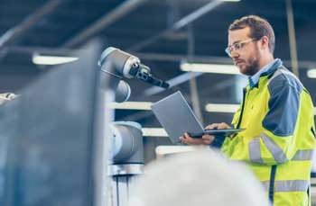 manufacturing worker on laptop