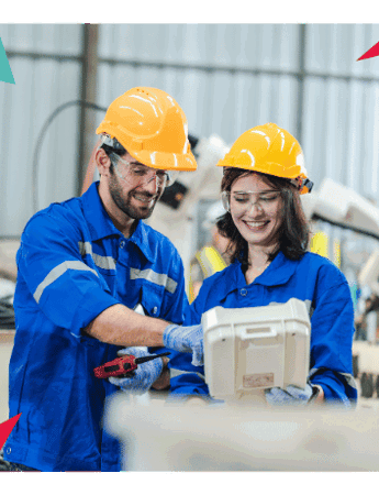 two manufacturing employees working facing right