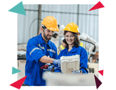 two manufacturing employees working facing right