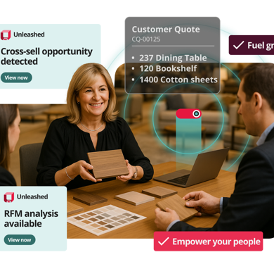 unleashed crm module hero image showing two people sitting front to front at a desk