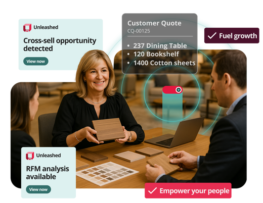 unleashed crm module hero image showing two people sitting front to front at a desk