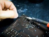 A person assembling an electronic product