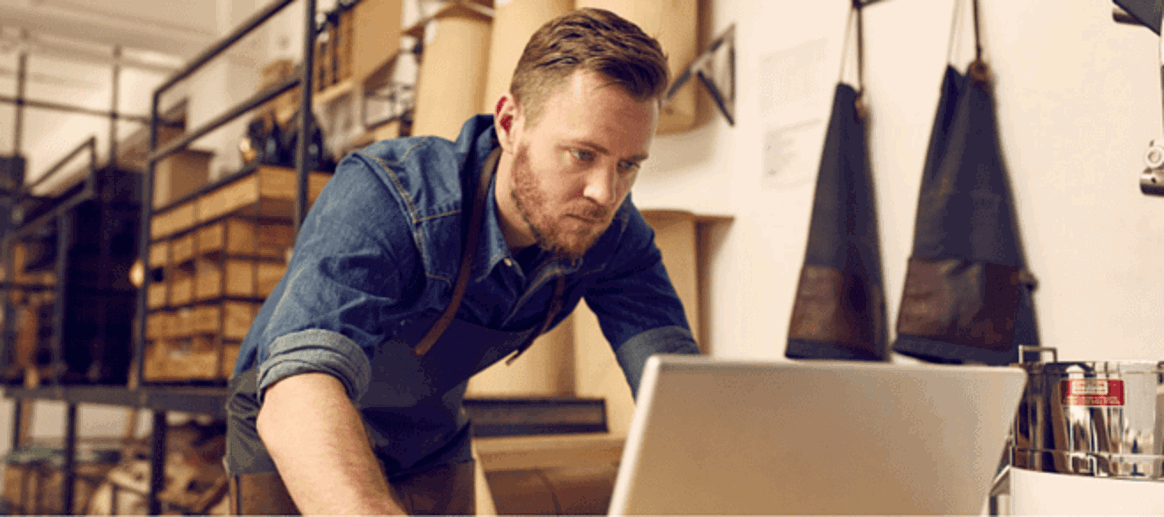 concerned employee looking at laptop screen