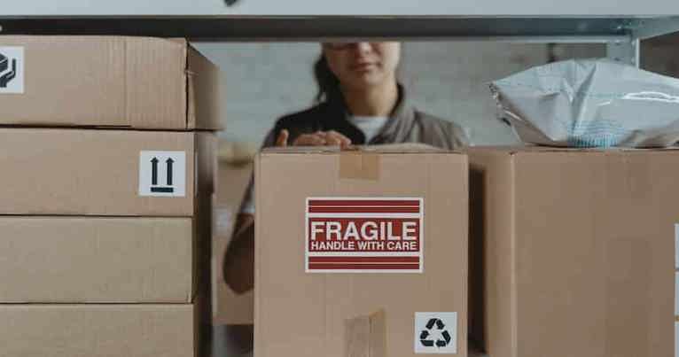 Parcel on shelf with fragile sticker