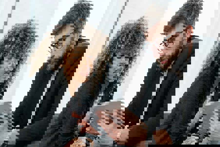 man and woman looking at a tablet