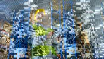 staff looking at inventory in warehouse